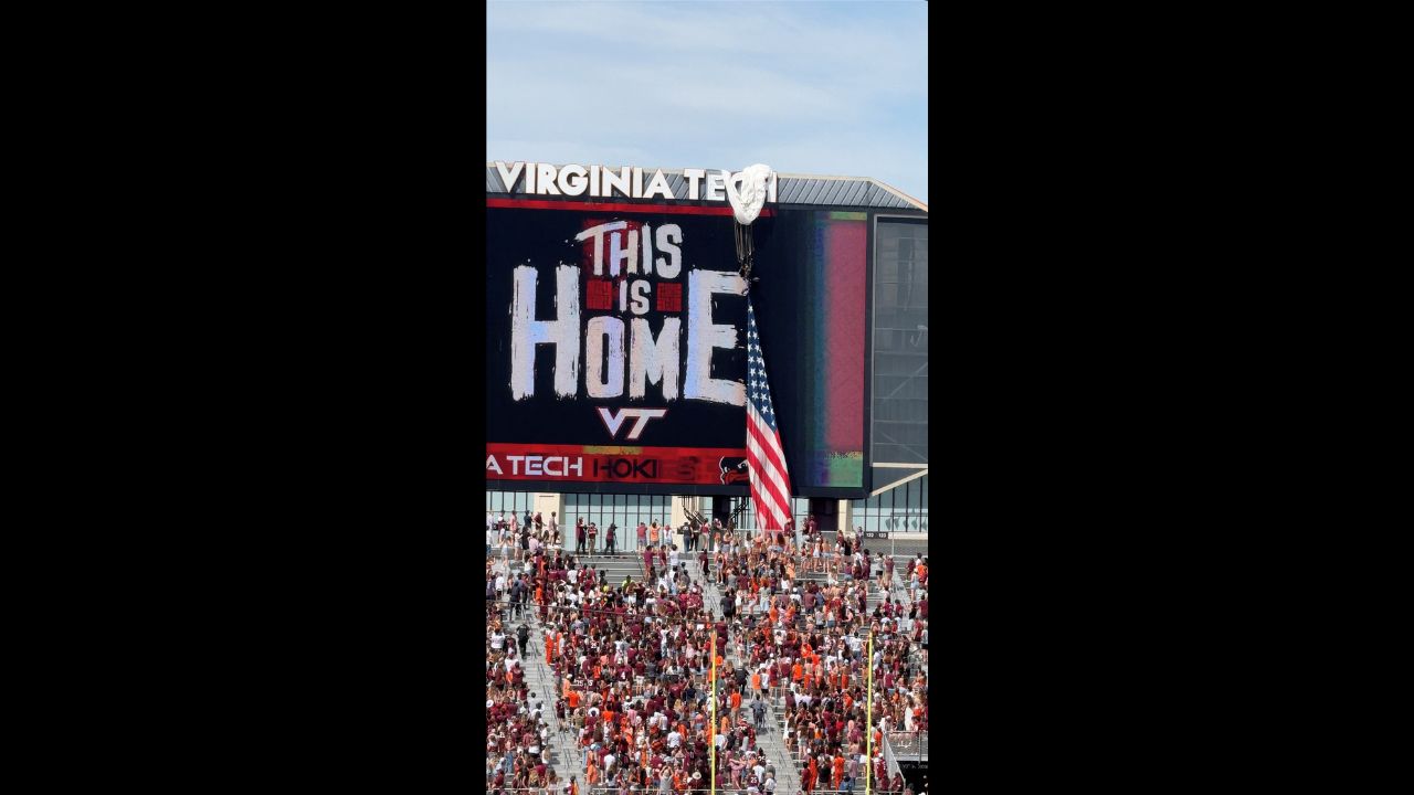Skydiver Left Dangling When Parachute Snags on Stadium Video Board