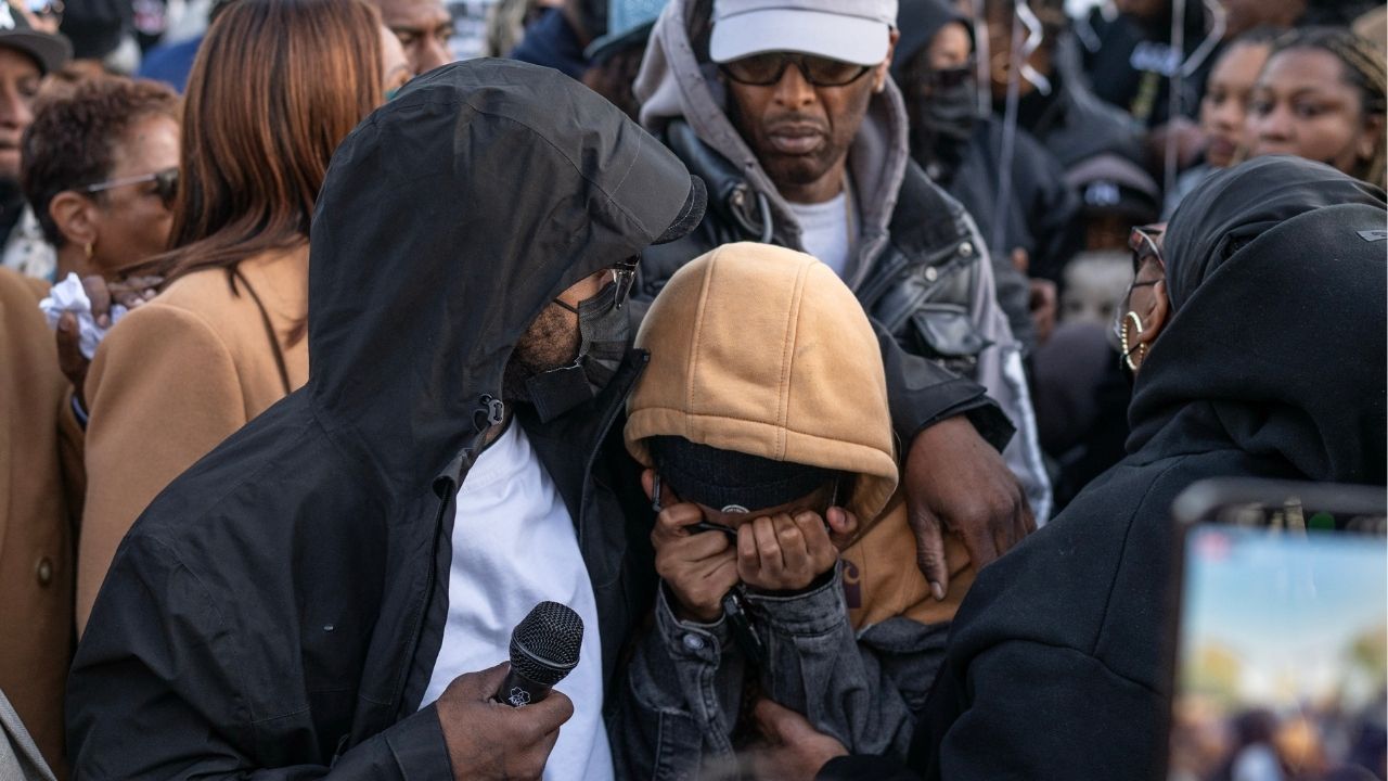 Gardy Pierre, Jaden’s father, left, comforts Jaden’s mother, Shanelle Weston, at a community vigil at Roy Wilkins Park in New York, April 20, 2026. Pierre was fatally shot at a park in broad daylight, and bystanders captured the shooting on video. Hundreds attended a vigil for him on Monday night. (Victor J. Blue/The New York Times)