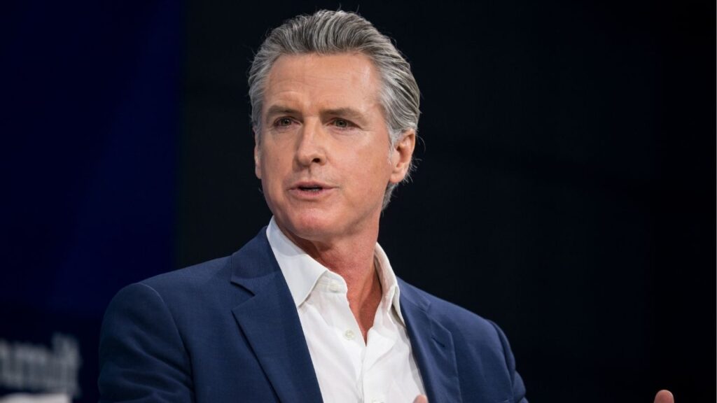 Gov. Gavin Newsom of California speaks during a conversation with Andrew Ross Sorkin at the DealBook Summit in New York, Dec. 3, 2025. The Trump administration and Democratic state leaders are blaming each other for the big problem of hospice fraud. The president has targeted California and Gov. Gavin Newsom in particular. (Karsten Moran/The New York Times)