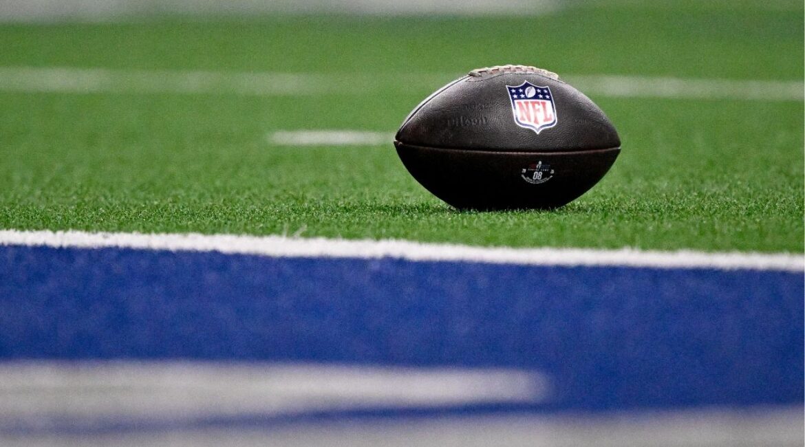 Jan 27, 2026; Frisco, TX, USA; A view of the NFL logo on a football at the goal line during the second half between the East and the West at the Ford Center at the Star. Mandatory Credit: Jerome Miron-Imagn Images