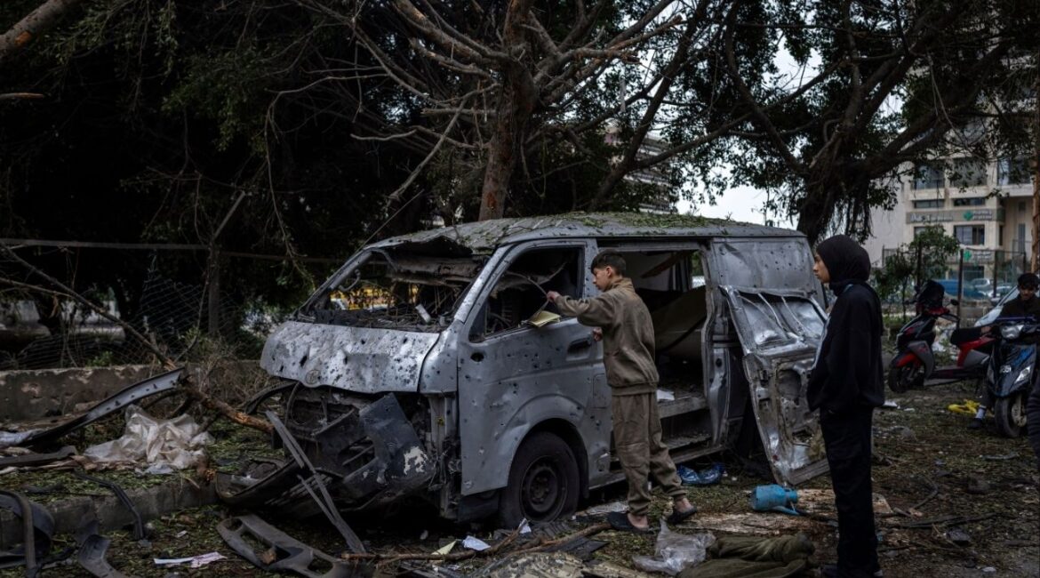 Local youths examine the wreckage of a vehicle after an airstrike in Beirut, Lebanon, that killed at least five overnight on Wednesday, April 1, 2026. There were more Israeli strikes across southern Lebanon on Wednesday, a day after Israel said it plans to occupy and control a large swath of the region and demolish entire towns. Lebanon’s national news agency reported airstrikes in several towns. (Diego Ibarra Sánchez/The New York Times)