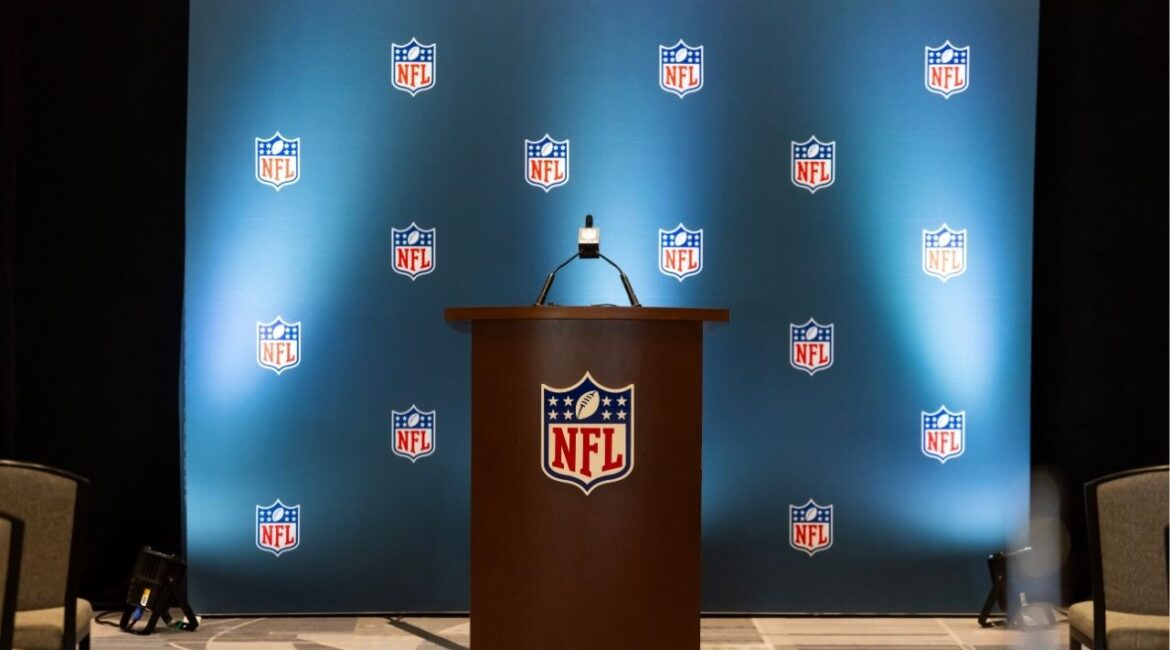 Mar 30, 2026; Phoenix, AZ, USA; Detailed view of the NFL shield logo on a lectern in a press conference room during the 2026 NFL Annual League Meeting at the Arizona Biltmore. Mandatory Credit: Mark J. Rebilas-Imagn Images