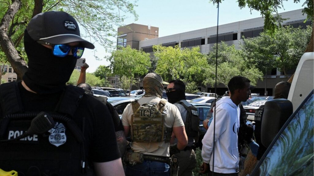 Masked law enforcement officers, including HSI and ICE agents, take people into custody at an immigration court in Phoenix, Arizona, U.S., May 21, 2025. (Reuters/Caitlin O'Hara)
