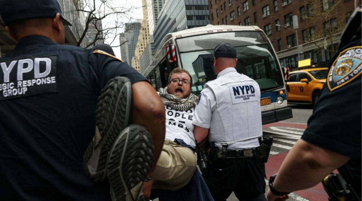 NYPD officers detain a demonstrator during a protest, amid a two-week ceasefire in the U.S.-Israeli conflict with Iran, along Third Avenue in the Midtown area of New York City, U.S., April 13, 2026. (Reuters/Shannon Stapleton)
