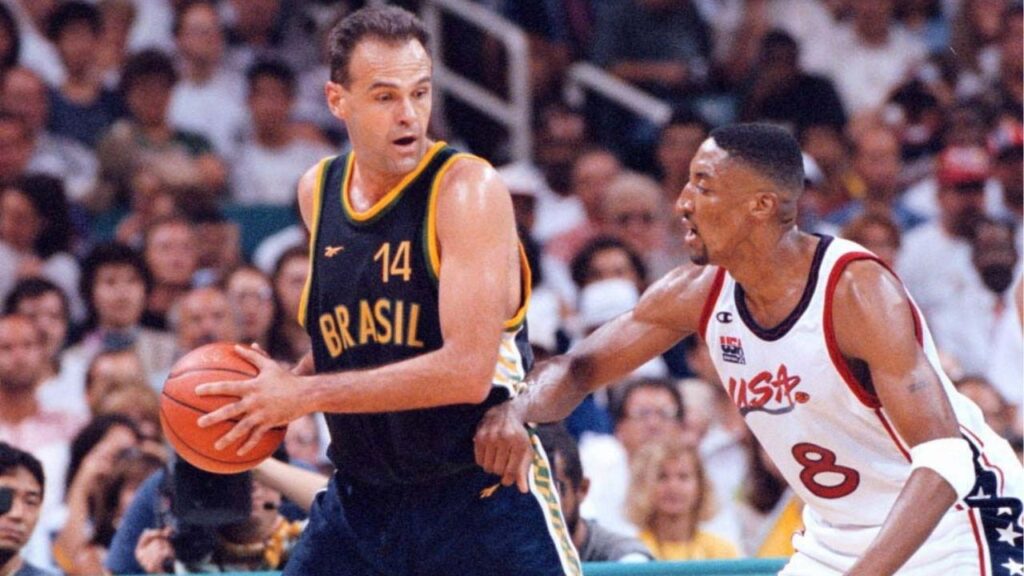 Oscar Schmidt of Brazil protects the basketball from Scottie Pippen of the U.S., during a mens’ quarterfinal at Summer Olympics in Atlanta on July 30, 1996. Schmidt, who was nicknamed the Holy Hand for shooting prowess and was widely regarded as the best player never to play in the NBA, died in Santana de Parnaiba, Brazil on April 17, 2026. He was 68. (Jose R. Lopez/The New York Times)
