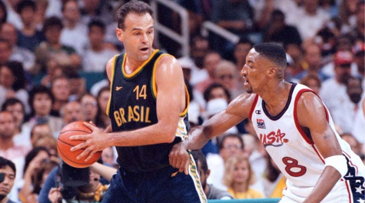 Oscar Schmidt of Brazil protects the basketball from Scottie Pippen of the U.S., during a mens’ quarterfinal at Summer Olympics in Atlanta on July 30, 1996. Schmidt, who was nicknamed the Holy Hand for shooting prowess and was widely regarded as the best player never to play in the NBA, died in Santana de Parnaiba, Brazil on April 17, 2026. He was 68. (Jose R. Lopez/The New York Times)