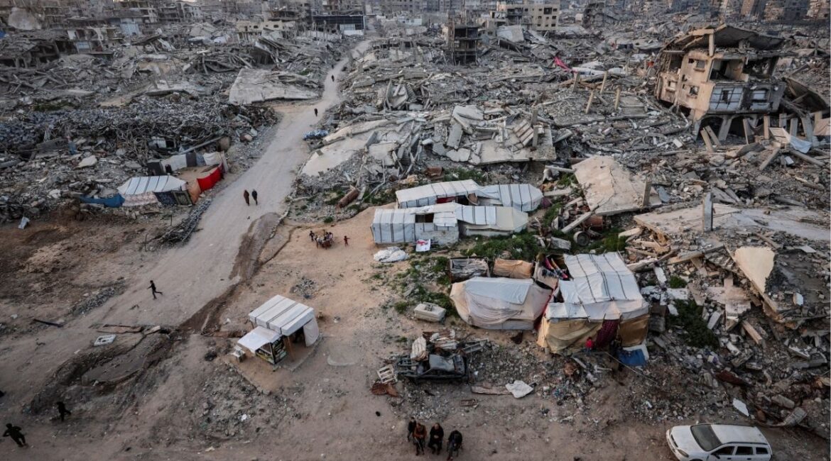 Palestinians gather near the rubble of residential buildings destroyed during the two-year Israeli offensive, on the first day of the holy month of Ramadan, in Gaza City, February 18, 2026. (Reuters File)