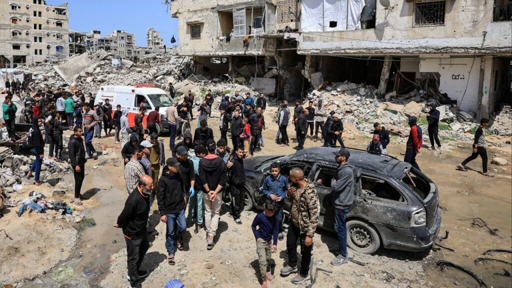 Palestinians inspect the damage after a person was hit by an Israeli strike while riding a bicycle, according to medics, in Gaza City, April 6, 2026. (Reuters/Dawoud Abu Alkas)