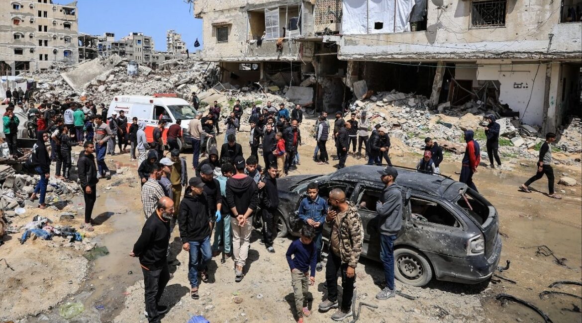 Palestinians inspect the damage after a person was hit by an Israeli strike while riding a bicycle, according to medics, in Gaza City, April 6, 2026. (Reuters/Dawoud Abu Alkas)