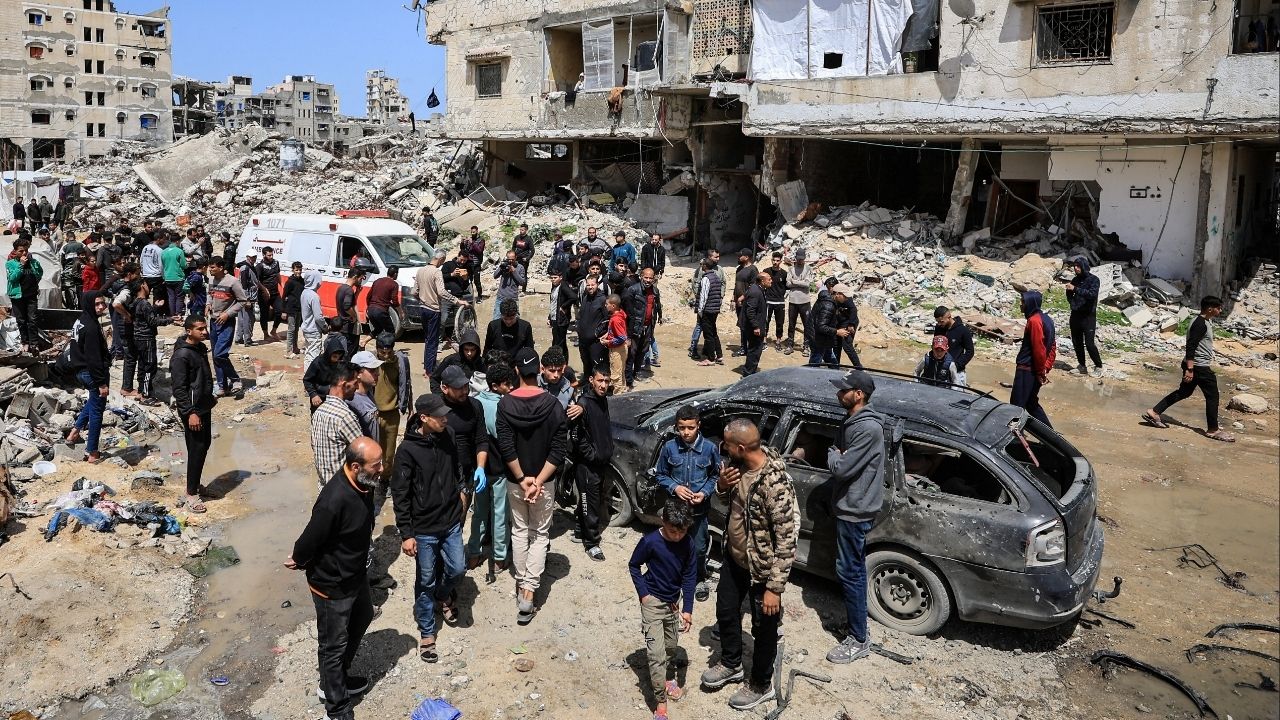 Palestinians inspect the damage after a person was hit by an Israeli strike while riding a bicycle, according to medics, in Gaza City, April 6, 2026. (Reuters/Dawoud Abu Alkas)