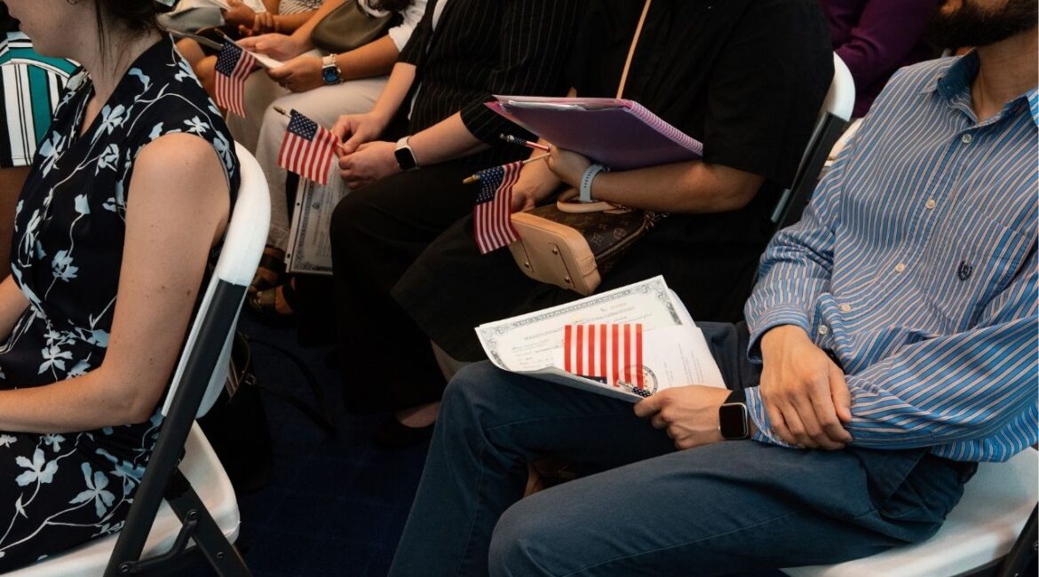 People attend a Naturalization Ceremony for new citizens in Savannah, Ga., July 29 2024. The Trump administration’s Justice Department has identified 384 foreign-born Americans whose citizenship it wants to revoke, part of a push to increase the pace of denaturalizations by assigning the cases to prosecutors in dozens of U.S. attorney’s offices across the country. (Anna Ottum/The New York Times)