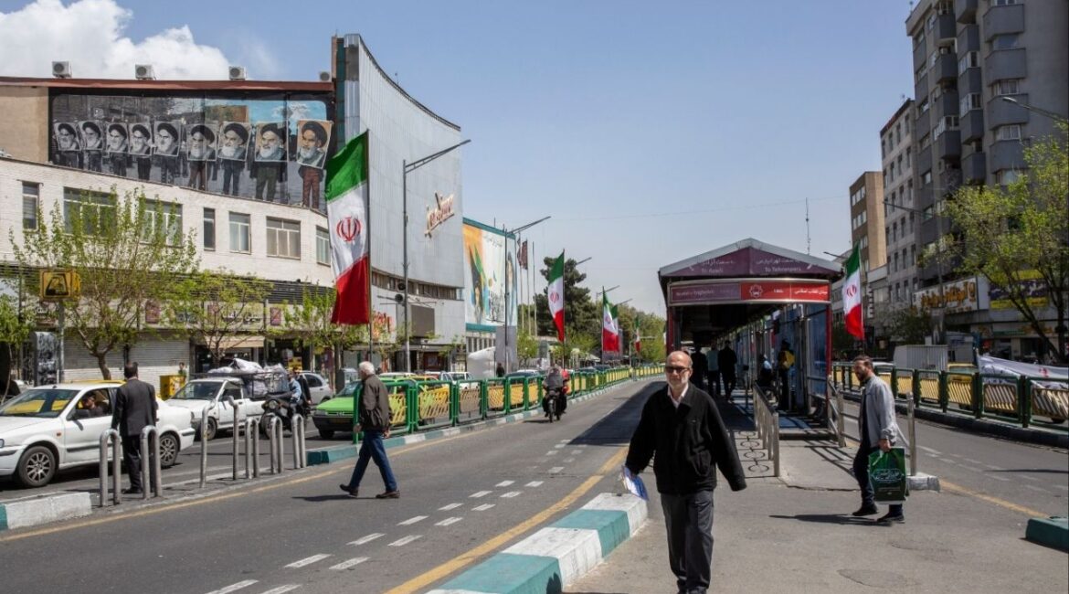 People on a street in Tehran, April 5, 2026. The intelligence chief of the Islamic Revolutionary Guards Corps was killed overnight on Monday, the latest blow to senior Iranian leadership since the United States and Israel began the war against Iran in late February. (Arash Khamooshi/The New York Times)