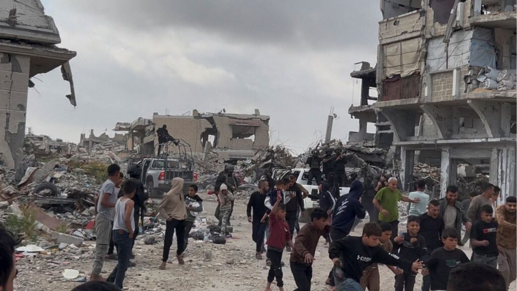 People react near Palestinians fighters after clashes with Israeli-backed militia, in Khan Younis, in the southern Gaza Strip, April 20, 2026, in this screengrab obtained from a video. Video obtained by REUTERS