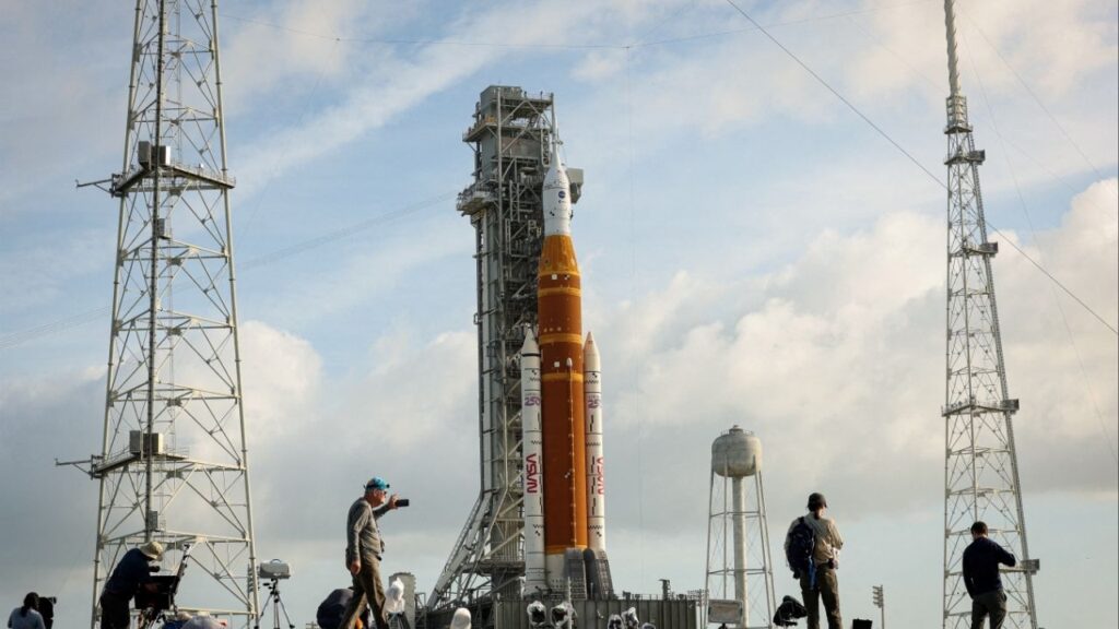 People set cameras to photograph NASA's Artemis II lunar flyby mission, with the next-generation moon rocket, the Space Launch System (SLS) rocket and the Orion crew capsule, on Pad 39B, ahead of the launch of the Artemis II mission at the Kennedy Space Center in Cape Canaveral, Florida, U.S., March 31, 2026. REUTERS/Brendan McDermid