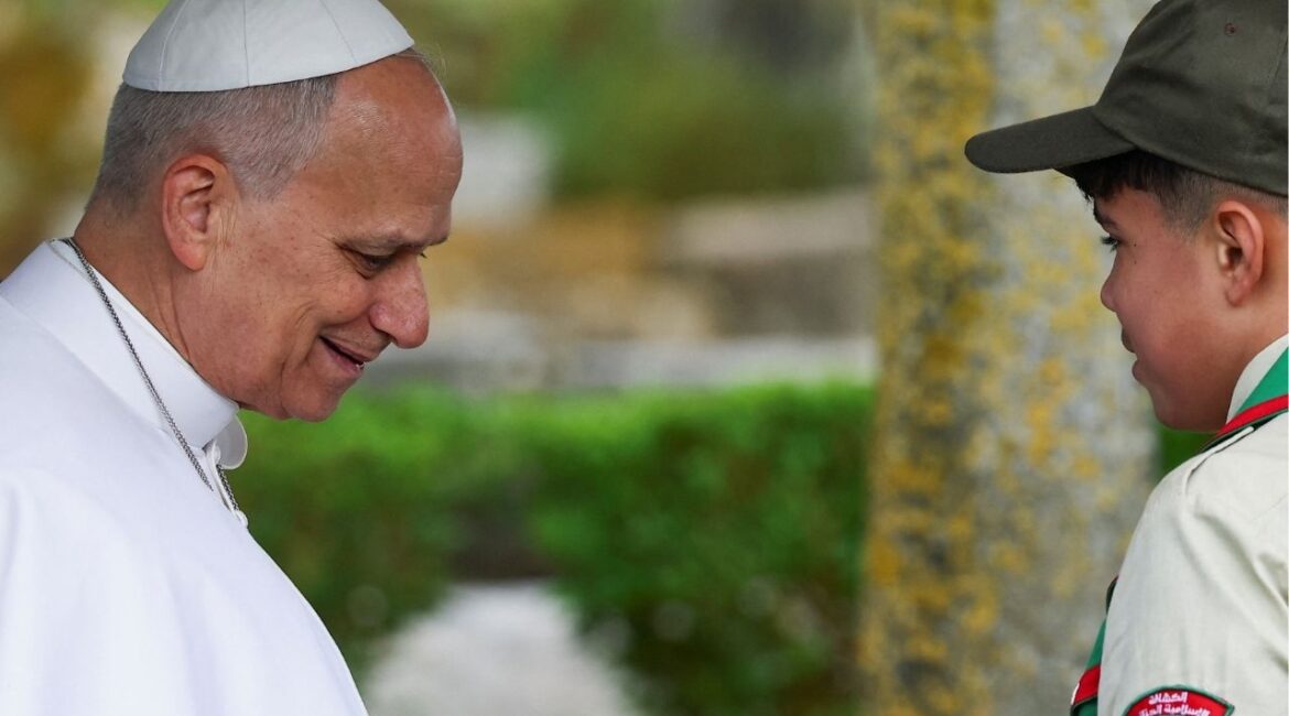 Pope Leo XIV reacts as he speaks with the youth who helped him plant a tree during his visit to the archaeological site of Hippo Regius in Annaba, Algeria, April 14, 2026. (Reuters/Guglielmo Mangiapane)