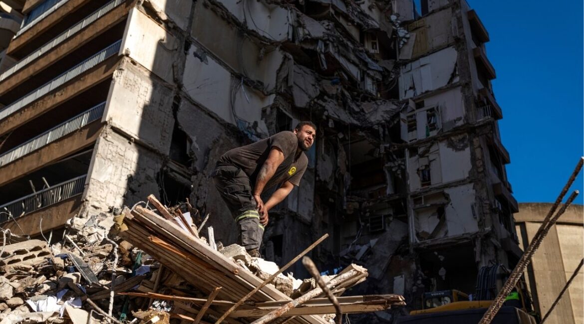 Rescue workers search the site of an Israeli airstrike in the Tallet el Khayat area of Beirut, Thursday, April 9, 2026. Israel says the truce with Iran does not cover Lebanon. Tehran says it does and has threatened retaliation unless the bombing stops. (Diego Ibarra Sánchez/The New York Times)