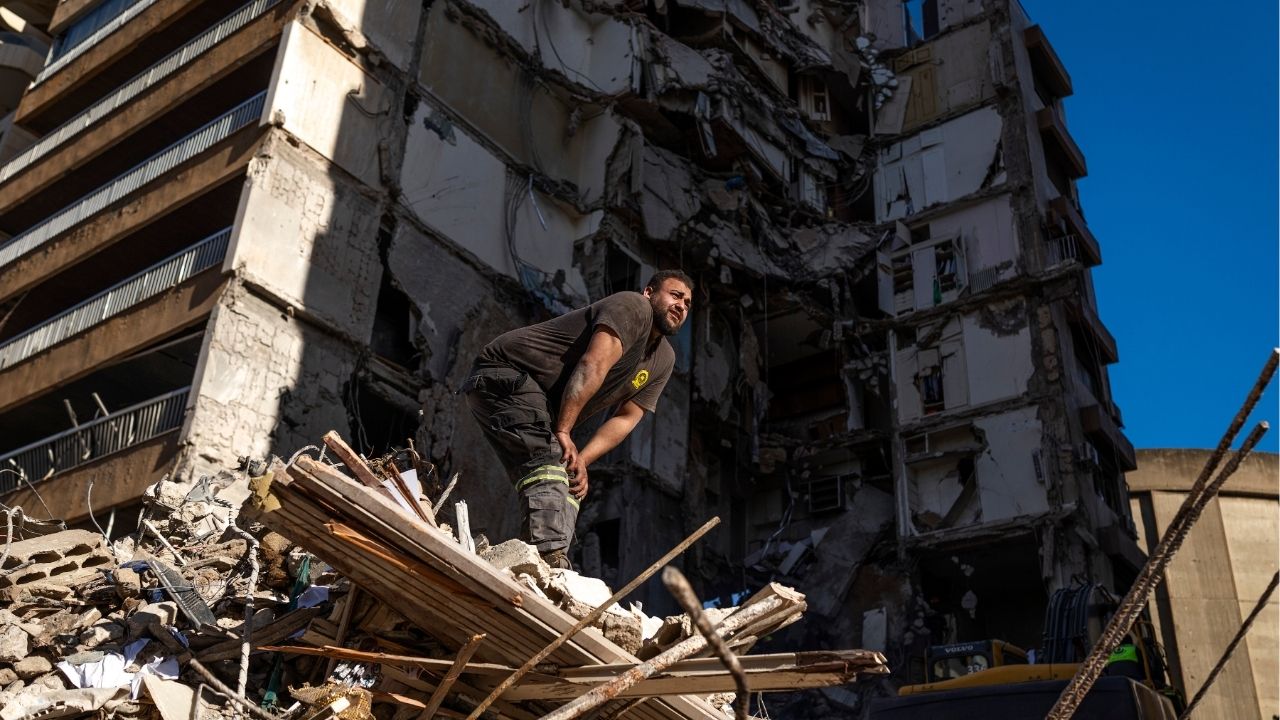 Rescue workers search the site of an Israeli airstrike in the Tallet el Khayat area of Beirut, Thursday, April 9, 2026. Israel says the truce with Iran does not cover Lebanon. Tehran says it does and has threatened retaliation unless the bombing stops. (Diego Ibarra Sánchez/The New York Times)