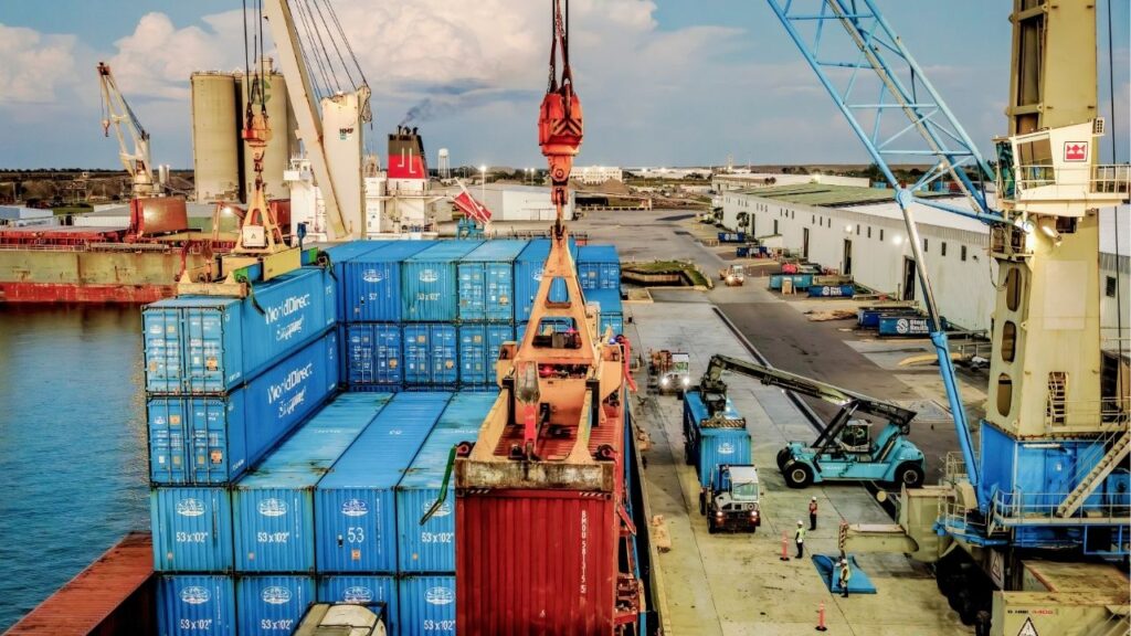 Shipping containers at Port Manatee in Palmetto, Fla., April 1, 2025. War in the Middle East has upended the world economy, the International Monetary Fund said, warning in an April 14, 2026 report that disruptions to oil markets could slow growth, fuel inflation and raise the possibility of a global recession. (Scott McIntyre/The New York Times)
