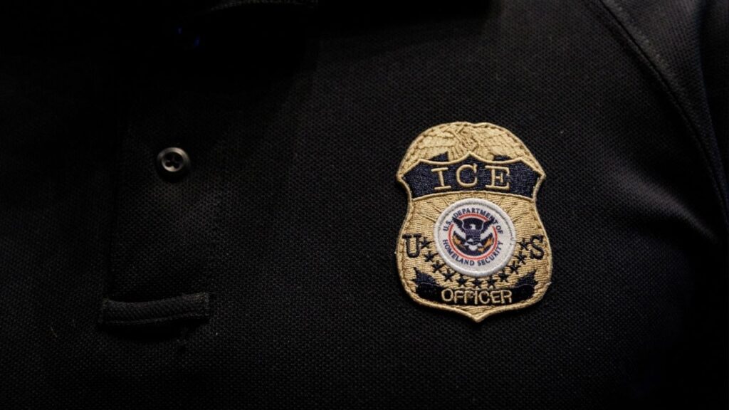 The badge of a U.S. Immigration and Customs Enforcement (ICE) is embroidered on a polo shirt of an ICE employee in Arlington, Texas, U.S. August 26, 2025. (Reuters File)