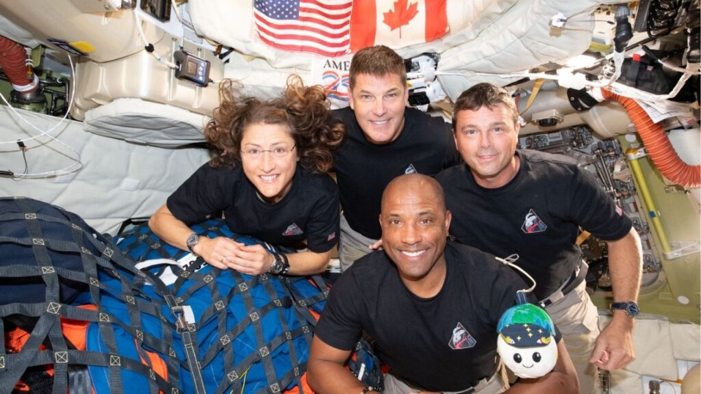 The crew of the Artemis II mission, clockwise from left: Mission Specialist Christina Koch, Mission Specialist and Canadian Space Agency astronaut Jeremy Hansen, Mission Commander Reid Wiseman and Pilot Victor Glover pose for a group photo with their zero gravity indicator “Rise” inside the Orion spacecraft on April 7, 2026. The crew members are scheduled to splash down off the coast of San Diego, Calif., on Friday, April 10. (NASA via The New York Times) — NO SALES; EDITORIAL USE ONLY—