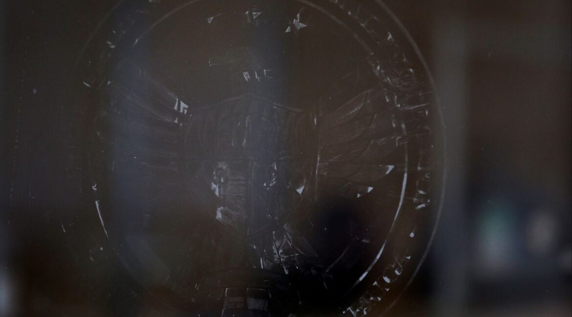 The name and logo for the Consumer Financial Protection Bureau (CPFB) is seen scraped off the door of its building in Washington, D.C., U.S., February 20, 2025. (Reuters/Brian Snyder)