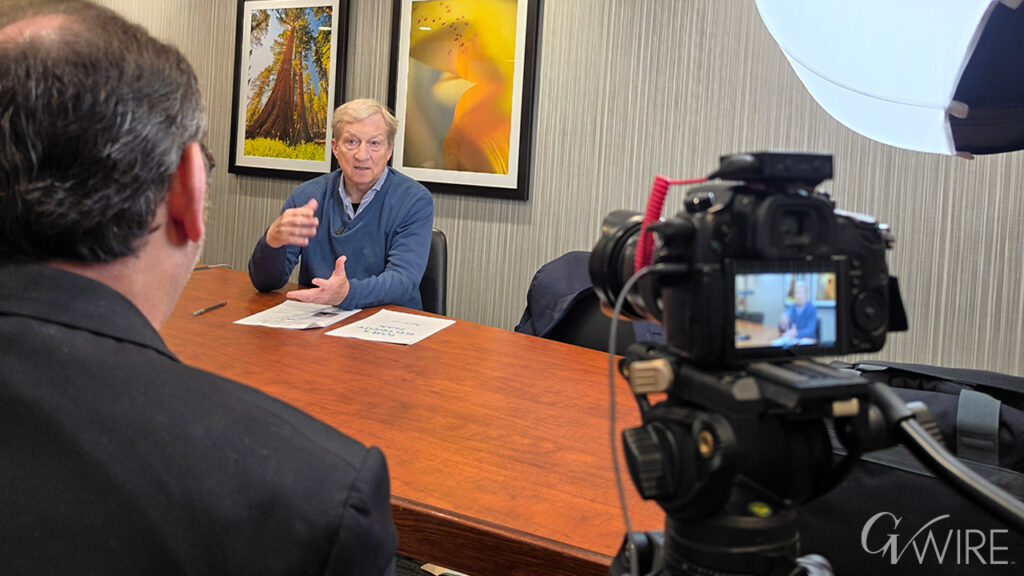 California gubernatorial candidate Tom Steyer at a desk talking to GV Wire's David Taub