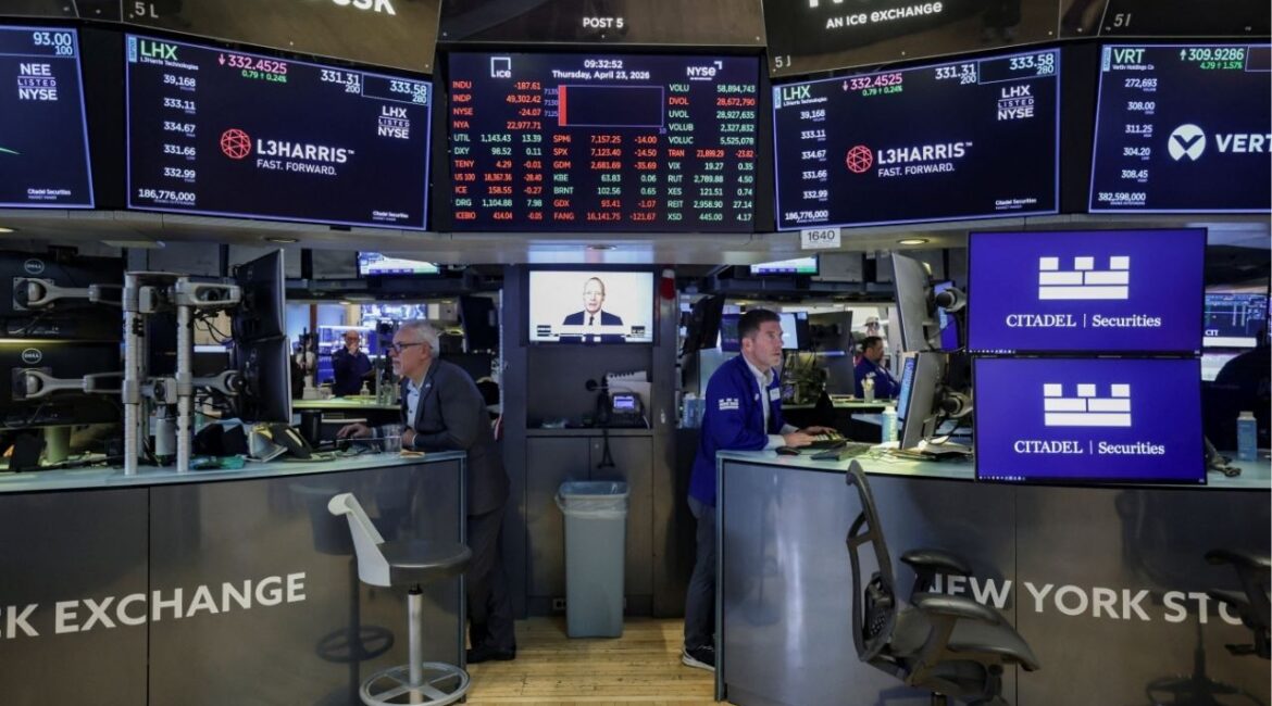 Traders work on the floor at the New York Stock Exchange (NYSE) in New York City, U.S., April 23, 2026. (Reuters/Jeenah Moon)