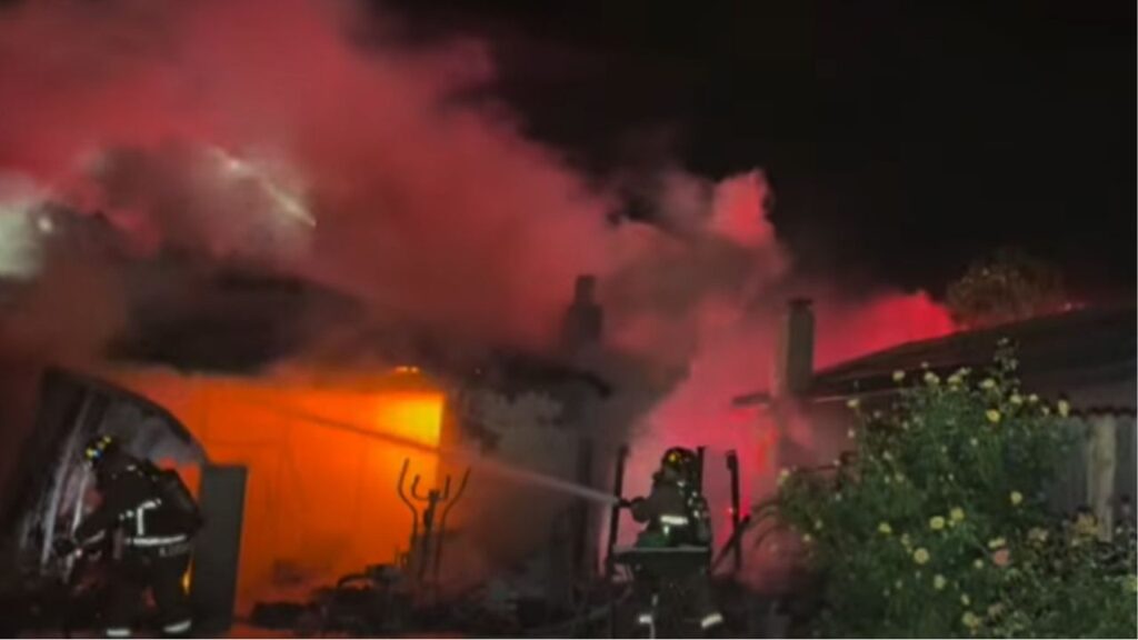 Two people were rescued from a Fresno house fire that escalated to a third alarm and left one home destroyed and others damaged. (Fresno FD)