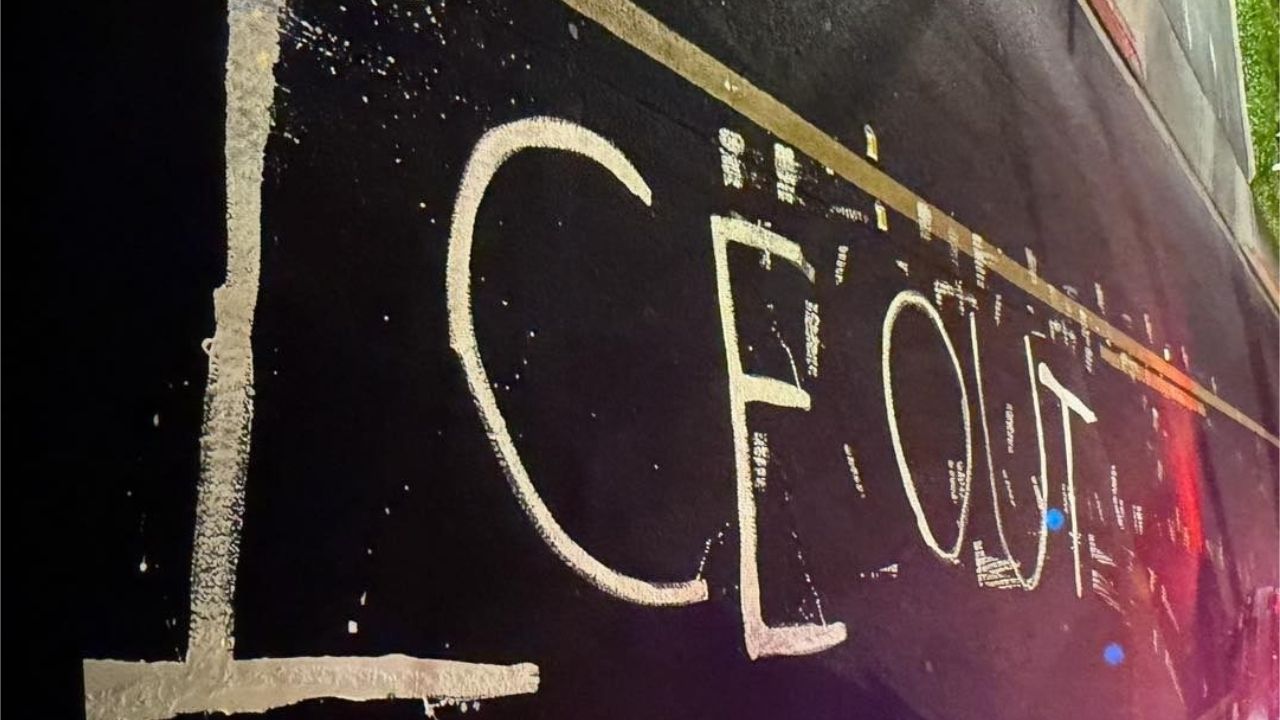 Two women were arrested on felony charges after police said they painted “ICE OUT” on a Modesto roadway during a protest near Doctors Medical Center. (Modesto PD)