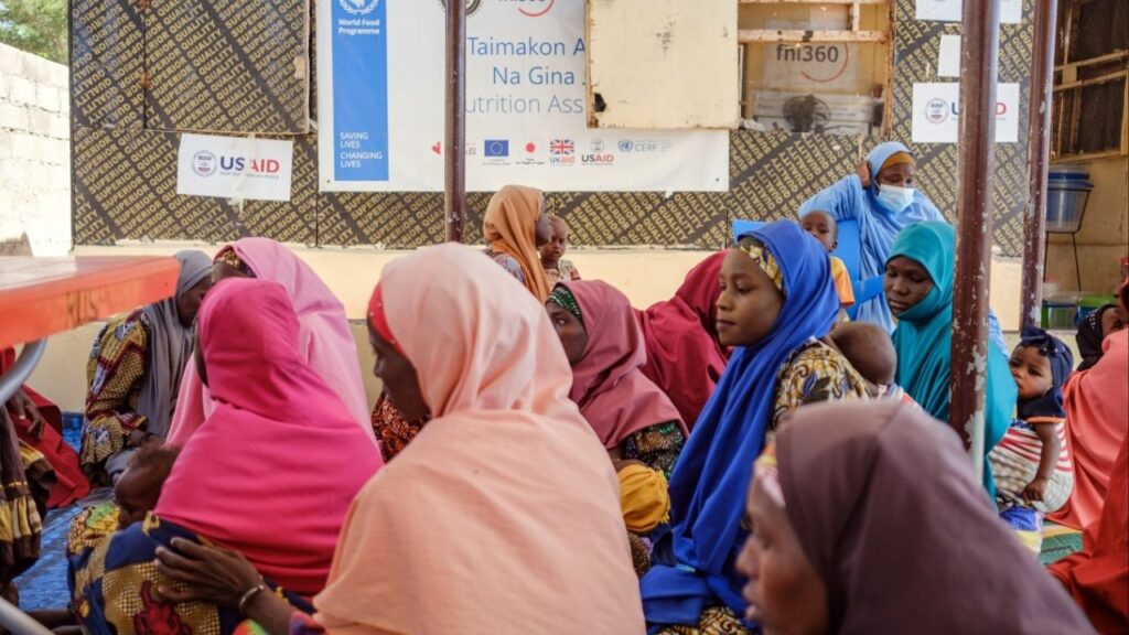 Women in Borno, Nigeria, wait with their children to receive nutrition treatment and therapeutic food at an outpatient therapeutic program run by FHI360, a nonprofit based in North Carolina, on Nov. 20, 2024. While organizations in the developing world were nearly shut out when the Trump administration began its overhaul of foreign aid in January 2025 , the big aid agencies DOGE had called wasteful received huge infusions of cash, a new analysis found. (Taiwo Aina/The New York Times)