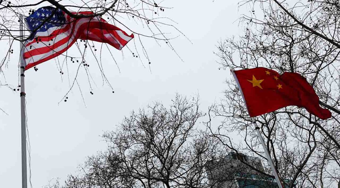 The flags of the United States and China wave in the wind in New York City, U.S., February 17, 2026. (Reuters/File Photo)