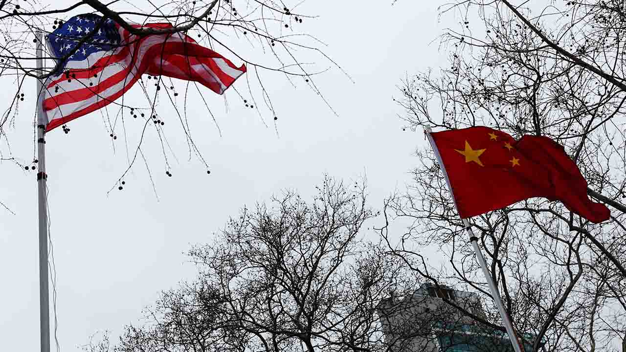 The flags of the United States and China wave in the wind in New York City, U.S., February 17, 2026. (Reuters/File Photo)