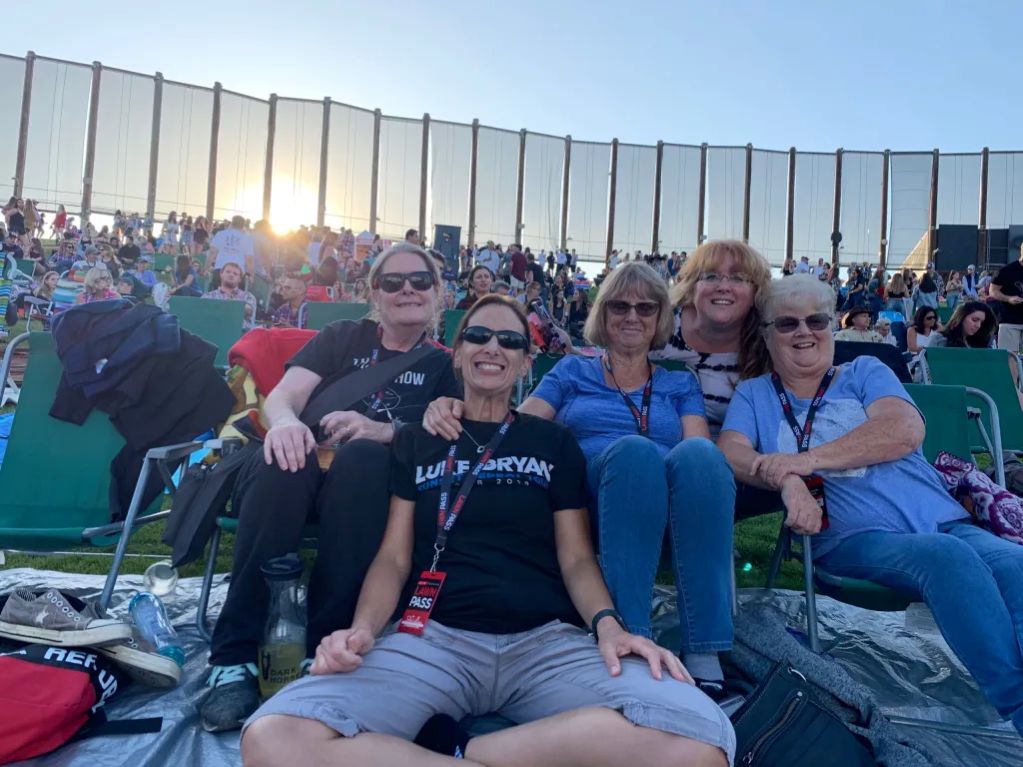 Image of the killed sisters with relatives and friends at a country music concert