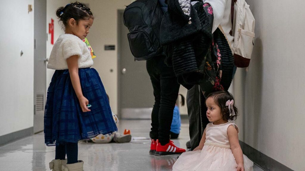 Children play as their guardians wait to be check into court hearings at U.S. immigration court in Manhattan, in New York City, U.S., January 13, 2026. (Reuters/David 'Dee' Delgado)