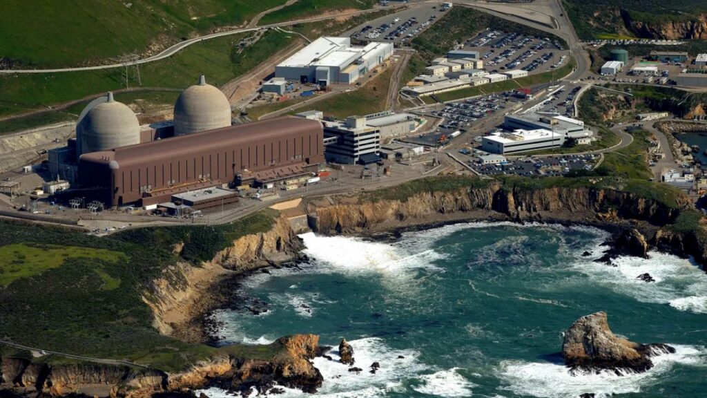 Aerial view of the Diablo Canyon nuclear plant alongside the splashing waves and seashore rocks of the Pacific Ocean
