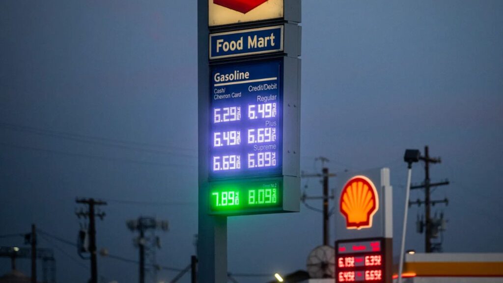 Image of Chevron and Shell gas station price boards in Bakersfield, California