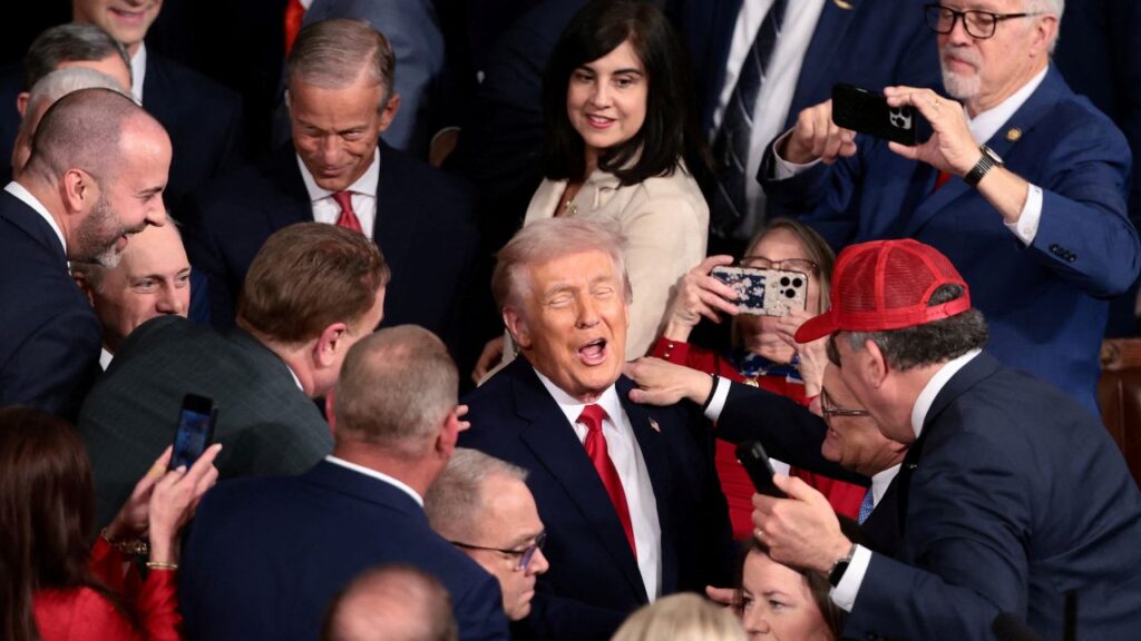 Image of President Trump surrounded by Republicans at the House Chamber