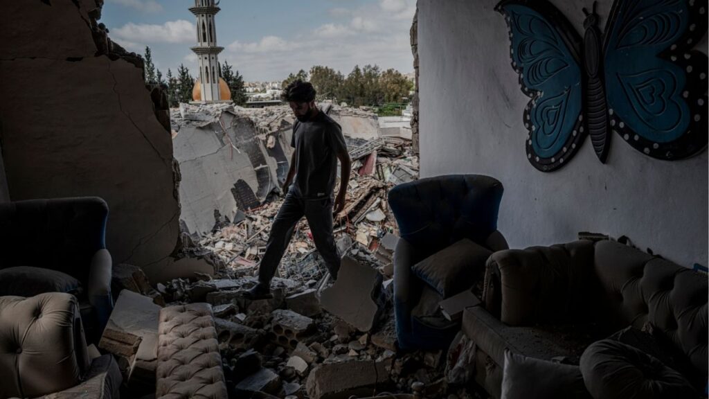 A family member assess the damage to a destroyed apartment in an apartment building in the aftermath of an Israeli airstrike in the Burj al-Shemali village near Tyre, Lebanon, on Tuesday, May 26, 2026. Israel intensified its military campaign against Hezbollah on Tuesday, striking targets across Lebanon after Prime Minister Benjamin Netanyahu said he had ordered the military to “increase the blows” against the Iran-backed militant group. (Daniel Berehulak/The New York Times)