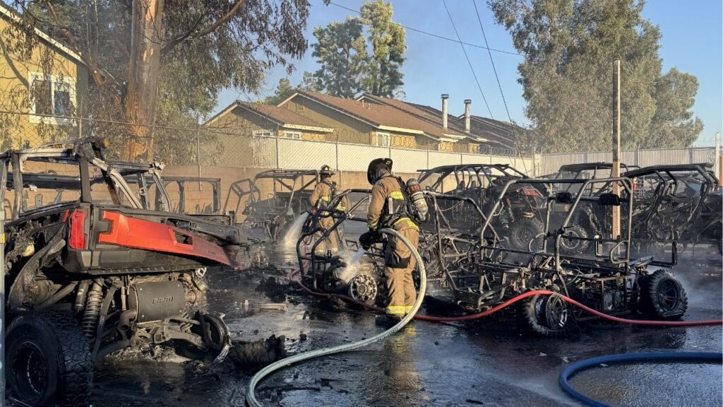 A fire behind Clawson Motorsports in north Fresno damaged 11 UTVs Monday evening and threatened a nearby apartment building before firefighters stopped the flames from spreading. (Fresno FD)