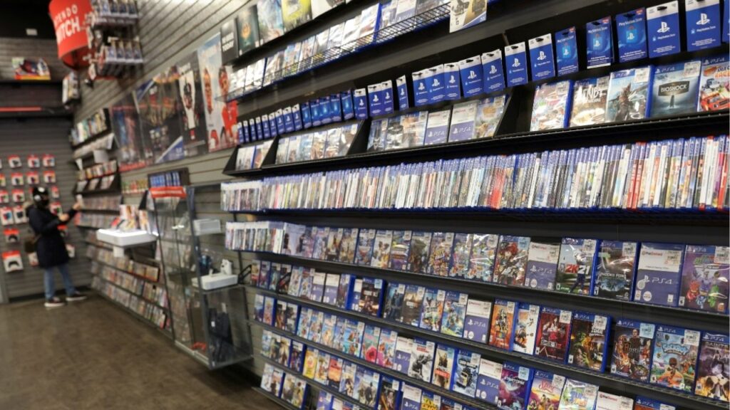 A person browses games in a GameStop in Manhattan, New York, U.S., December 7, 2021. REUTERS/Andrew Kelly