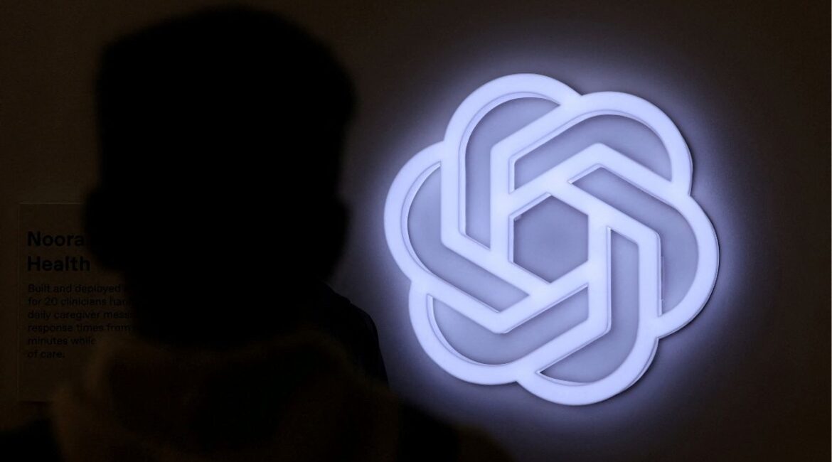 A person stands next to the logo of ChatGPT, an AI-powered chatbot by OpenAI at Bharat Mandapam, one of the venues for AI Impact Summit, in New Delhi, India, February 17, 2026. (Reuters File)