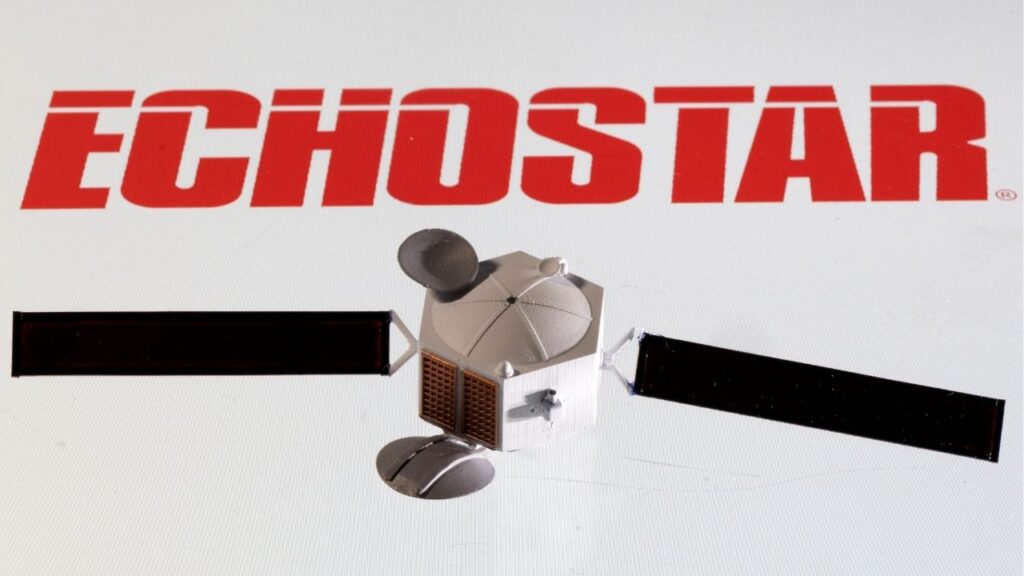 A satellite model is placed on EchoStar Satellite Services logo in this picture illustration taken April 4, 2022. (Reuters/Dado Ruvic/Illustration)