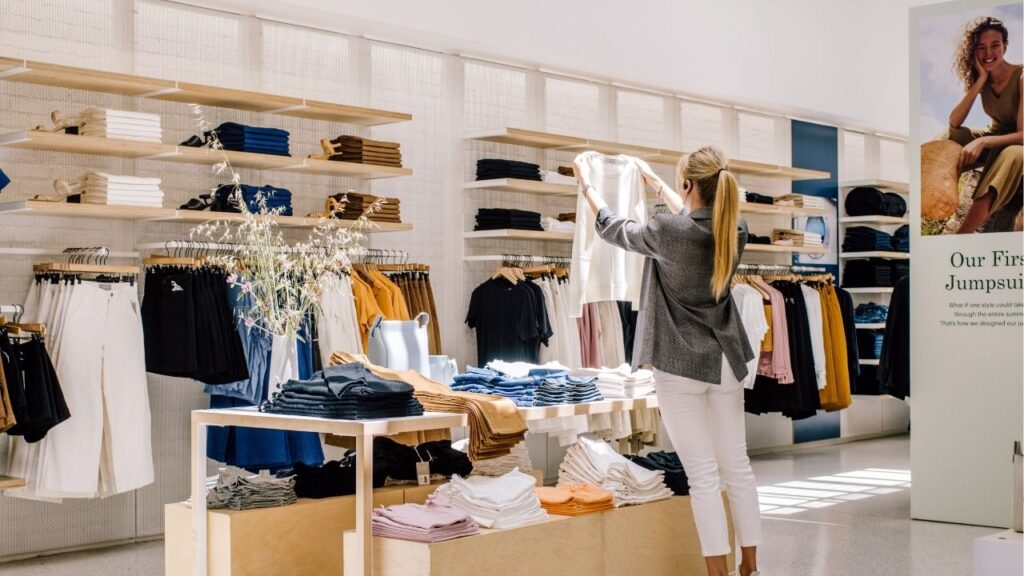 A store employee folds sweaters for a display at an Everlane store in San Francisco on May 28, 2019. Shein, the ultra low priced online retailer, has purchased Everlane, the millennial standby branded as sustainable. (Justin Kaneps/The New York Times)