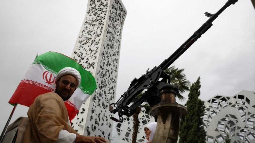 An Iranian couple arrive on a military vehicle during a public wedding ceremony called "Sacrificed couple wedding", in Tehran, Iran, May 18, 2026. Majid Asgaripour/WANA (West Asia News Agency) via Reuters