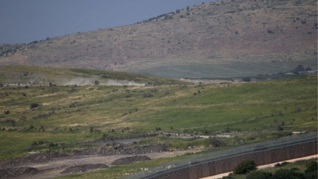An Israeli military vehicle operates in Lebanon by the Israeli‑Lebanese border, as seen from northern Israel, May 14, 2026. (Reuters/Shir Torem)