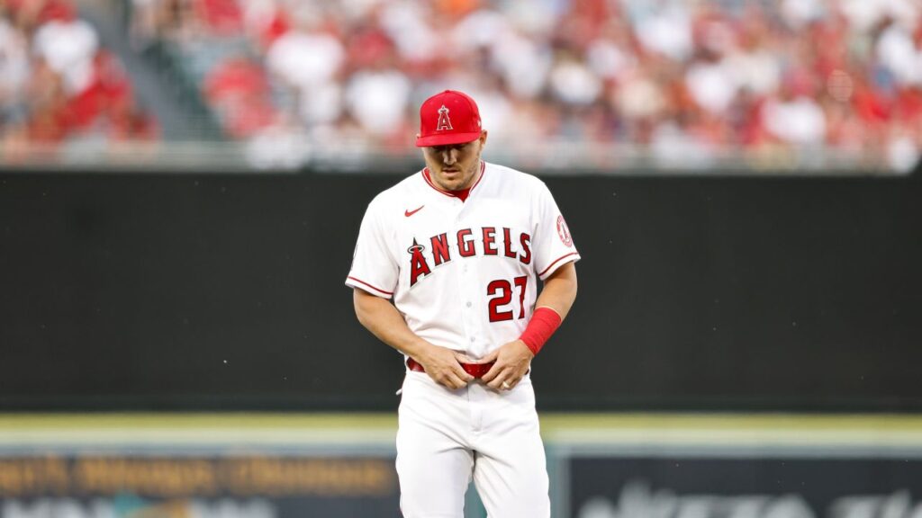 Image of Angels outfielder Mike Trout in a home white uniform with red lettering and a red ballcap