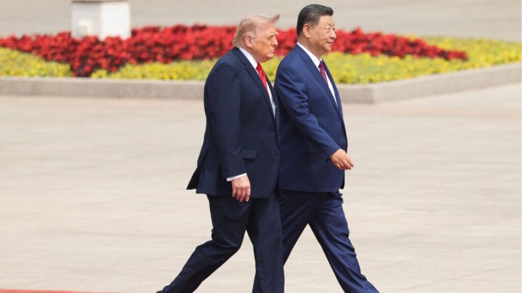 Chinese President Xi Jinping walks with U.S. President Donald Trump during a welcome ceremony at the Great Hall of the People, in Beijing, China, May 14, 2026. REUTERS/Maxim Shemetov/Pool