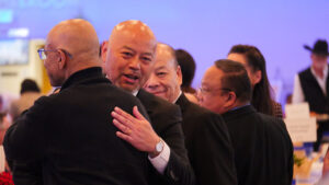 Clovis Mayor Vong Mouanoutoua hugs an attendee during the annual mayor’s breakfast in Clovis. (GV Wire/Eric Martinez)