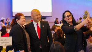 Clovis Mayor Vong Mouanoutoua poses for a photo with members of the City of Clovis Administration Office during the annual mayor’s breakfast in Clovis. (GV Wire/Eric Martinez)