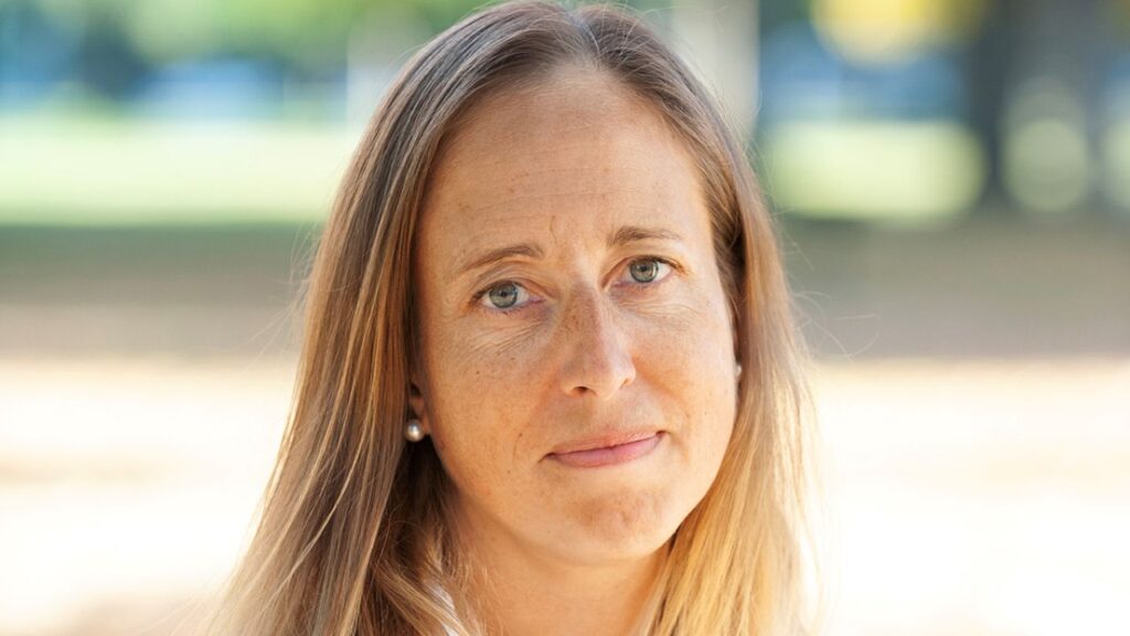 Image of Dr. Tracy Beth Hoeg in a physician's white robe.